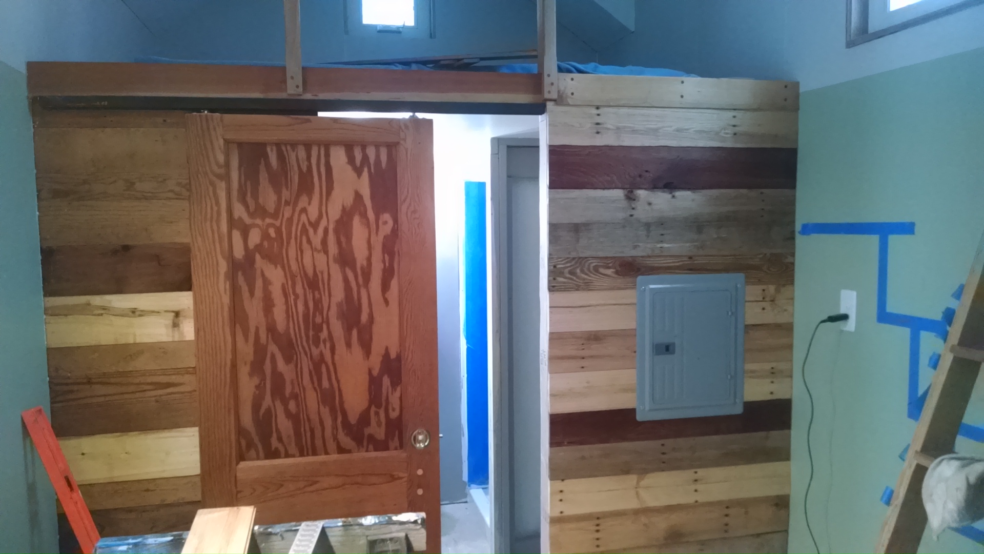 the second side of my bathroom wall is done, so I finally got to put on the cover for my breaker box; there will be a closet and alternating tread stairs in front of it